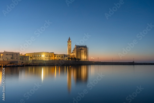 View of the beautiful Romanesque Cathedral Basilica of San Nicola Pellegrino from port on sunset  in Trani.