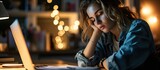 Head shot exhausted female student holding head in hand tired of monotonous study alone at home Sleepy unhappy young woman feeling lack of energy motivation working distantly online on computer