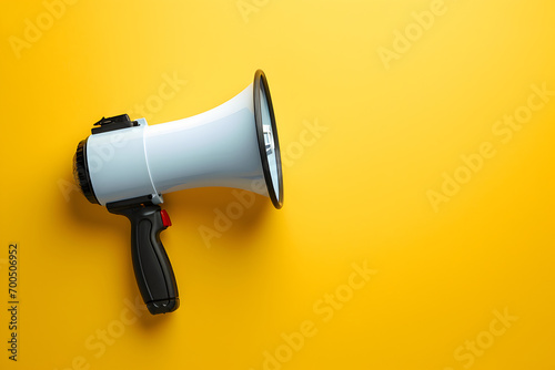 Megaphone or hand speaker isolated on yellow background with copy space