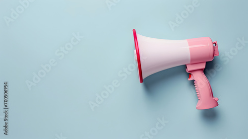 Megaphone or hand speaker isolated on blue background with copy space