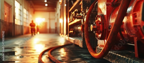 Firefighter in storage room with fire hoses. Creative Banner. Copyspace image