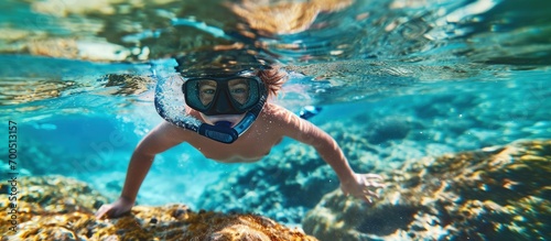 Child snorkeling Kids swim underwater Beach and sea summer vacation with children Little girl watching coral reef fish Marine life on exotic island Kid swimming and diving with snorkel and mask
