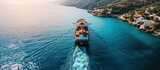 Aerial drone photo of industrial colourful vessel carrying heavy truck size containers cruising the Aegean deep blue sea. Creative Banner. Copyspace image