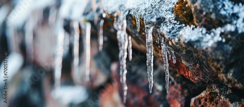 cold and frosty icicles forming on the wall icicles winter and icicles close up icicles. Creative Banner. Copyspace image