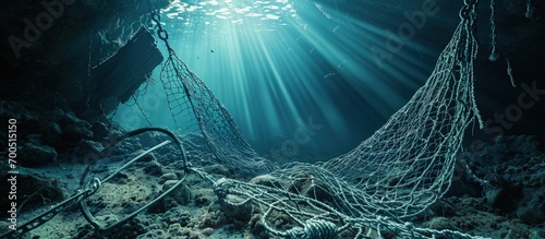 A fishing net underwater fixed on the seabed deep water. Creative Banner. Copyspace image