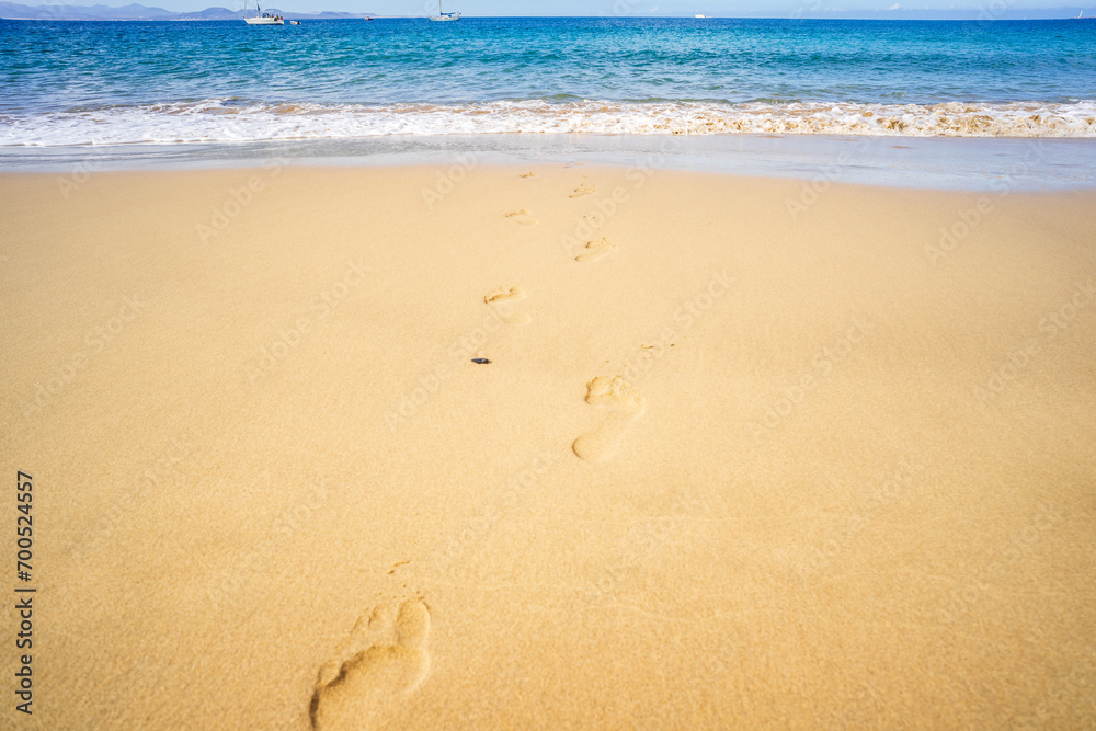 View of the ocean waves, sandy beach and sky. View of the ocean waves, sandy beach and sky.
