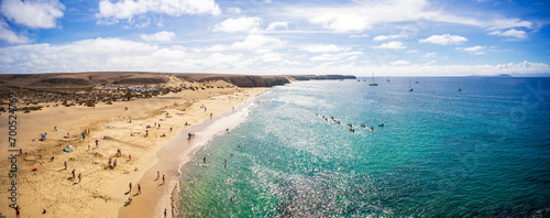 Panoramic view of Playa de Mujeres. Popular beach in Lanzarote on Playa Blanca, Canary Islands, Spain.