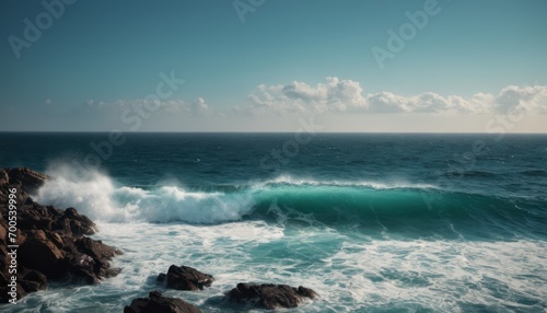  a large body of water with a wave coming in from the top of a rocky outcropping next to a large body of water with rocks in the foreground. © Jevjenijs