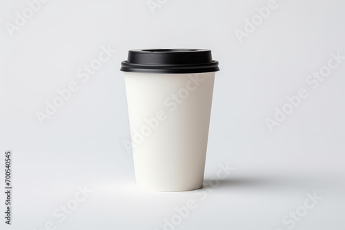 Disposable cup of coffee on white
