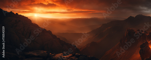 a mesmerizing sunset, with a fiery orange sun setting amidst a backdrop of dark, rocky terrain.
