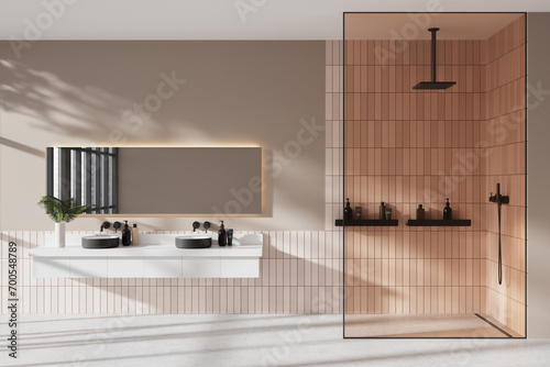 Modern hotel bathroom interior with double sink and shower with accessories