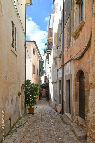 A narrow street among the old houses of Monte San Biagio, a medieval village in the mountains of Lazio, Italy.