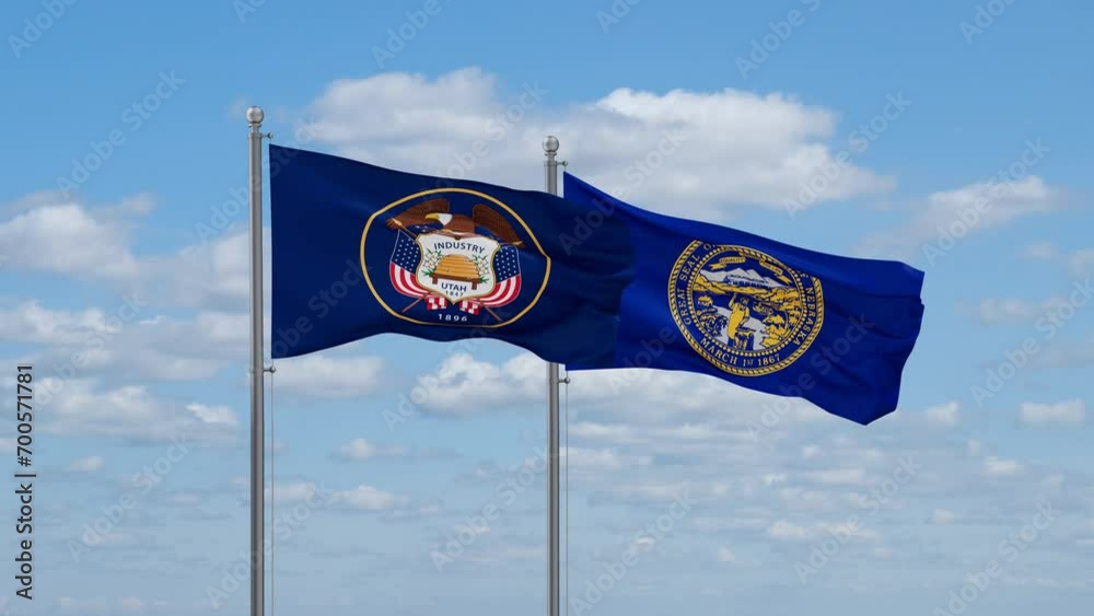 Nebraska and Utah US state flags waving together on cloudy sky, endless seamless loop Nebraska and Utah US state flags waving together on cloudy sky, endless seamless loop