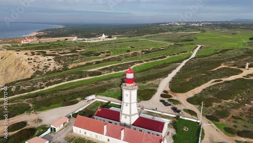 Aerial orbit of the Cabo Espichel Lighthouse near to Sesimbra, Portugal. One of the oldest lighthouses in Portugal, built in 1790 and still operational today. photo