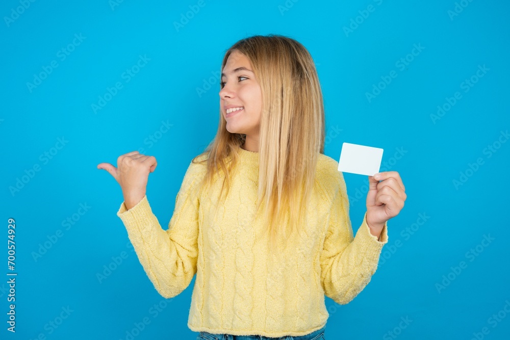 beautiful teen girl hold credit card point empty space beautiful teen girl hold credit card point empty space