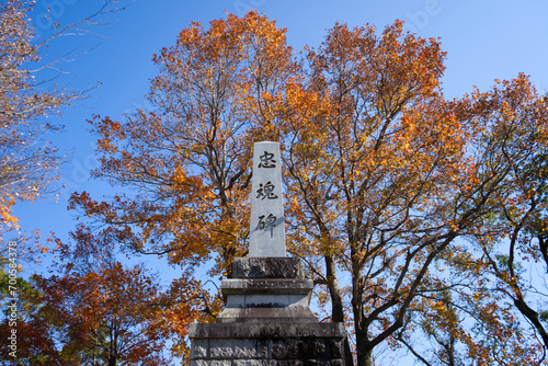 Stone pillar platform with changing leaves in the background In the Kisuki Castle area photo