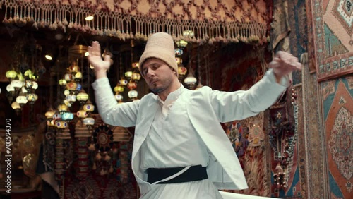 Sufi Whirling Dervish dance in traditional dress. Turkey photo