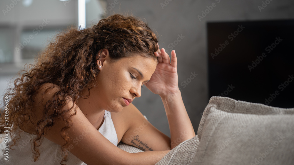 Young attractive latin woman lying at home living room couch feeling sad tired and worried suffering depression in mental health, problems and broken heart concept.
Young attractive latin woman lying at home living room couch feeling sad tired and worried suffering depression in mental health, problems and broken heart concept.