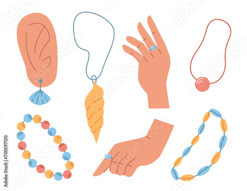 Jewelry and summer accessories set. Ear with earring. Hands with ring. Necklaces and bracelets