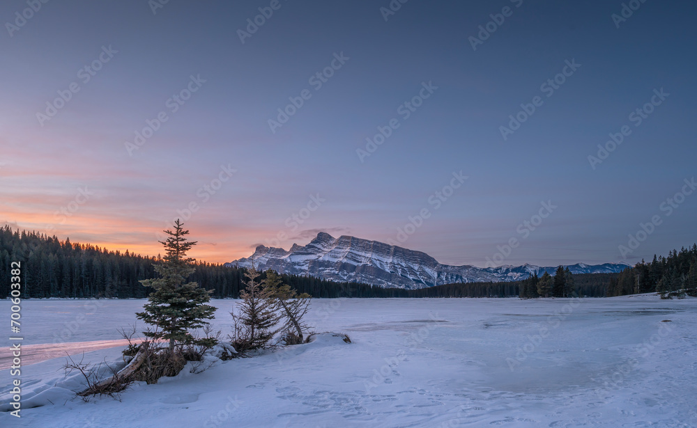 Winter view of spruce trees and Mount Rundle at Two Jack Lake in Banff National Park, Alberta, Canada Winter view of spruce trees and Mount Rundle at Two Jack Lake in Banff National Park, Alberta, Canada