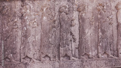 A procession of Persian spearmen. Ancient bas-relief on the wall (anaglyphy). Achaemenid Empire. Iranian culture photo