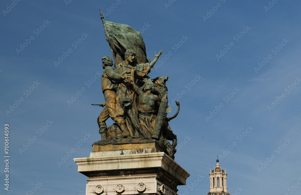 Statue On The Top Of The Vittorio Emanuele II Monument In Rome Italy On A Wonderful Spring Day With A Few Clouds In The Sky