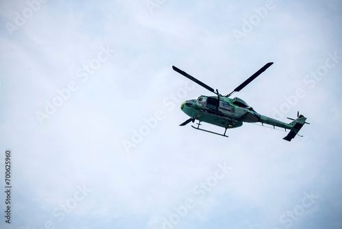 helicopter is flying on isolated blue sky