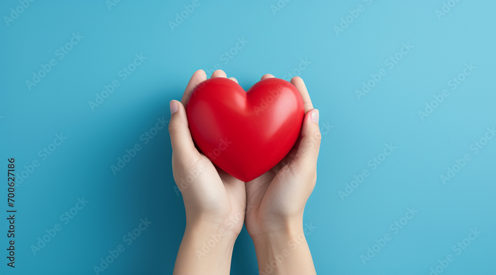 The essence of love with hands presenting a red heart on a serene blue background, an eloquent symbol of affection. Generative AI. The essence of love with hands presenting a red heart on a serene blue background, an eloquent symbol of affection. Generative AI.