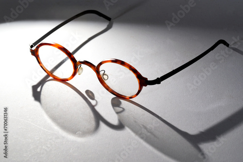 Den Helder, Netherlands. November 2023. A pair of glasses with shadow on white background.