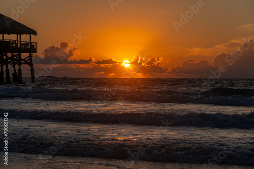 Striking sunrise iwth waves on the ocean © dfriend150
