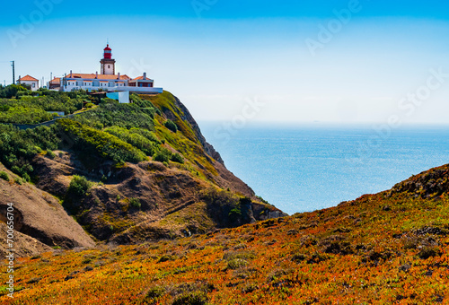 Stunning landscape with Cabo da Roca lighthouse overlooking the promontory towards the Atlantic Ocean, Portugal photo