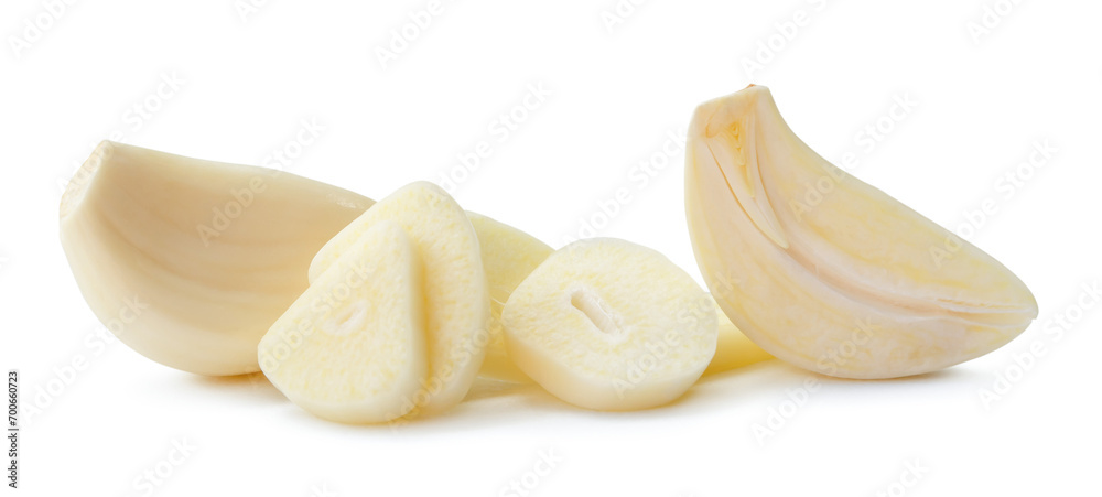 Peeled garlic clove with slices in stack isolated on white background with clipping path Peeled garlic clove with slices in stack isolated on white background with clipping path