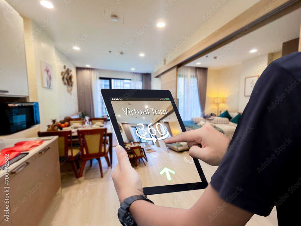 Virtual tour 360 for real estate technology concept.Man hands holding digital tablet - obrazy, fototapety, plakaty 