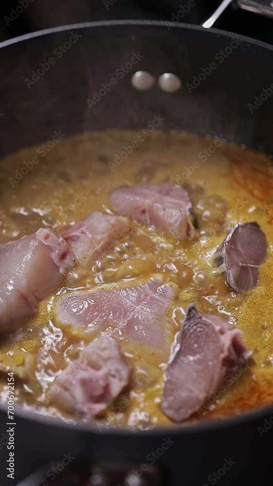 Close up shot of preparing spicy fish curry.boiling fish curry Indian kerala style Close up shot of preparing spicy fish curry.boiling fish curry Indian kerala style