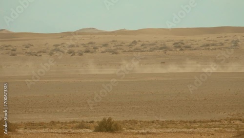 A flat interfluve area of the desert on the Arabian Peninsula. Dense sand, drained upland soil turns the plakor into a natural highway without lane markings, off-road terrain photo