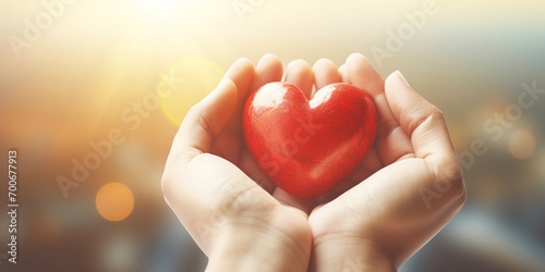 Close up of woman hands holding red heart. Love and health care concept Happy valentine day