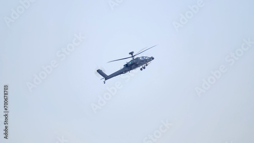 British army Boeing Apache Attack helicopter gunship AH64E (AH-64E ArmyAir606) at full bank in a hammerhead stall turn, Wiltshire UK