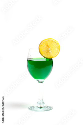 Glass with pure water and lemon on a white background
