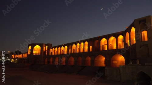 Old Khajoo bridge at night, across the Zayandeh River in Isfahan, Iran. photo