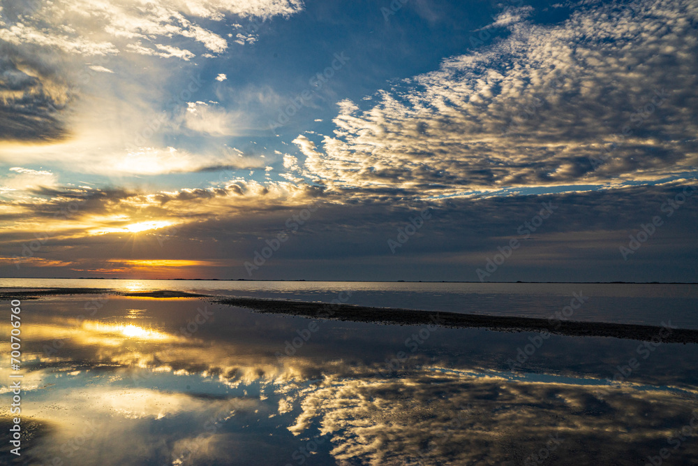 morning clouds reflected on the water