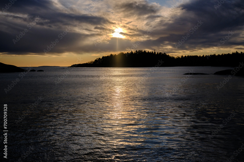 Magical sunset in winter in January over Lake Vaettern in Skaraborg in Vaestra Goetaland in Sweden