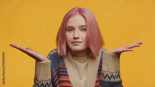 Indecisive Woman with Pink Hair Shrugging