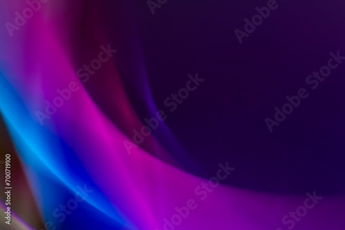 Abstract background with colored lines and blur effect of purple and blue colors. Gradients, waves and twisting.