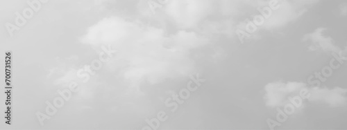 White cloud in the sky. View on a soft white fluffy cloud as background. Cloudy sky, white clouds, black background pattern. The gray cloud trendy photo. White sky image	