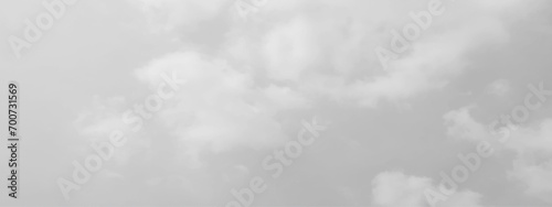 White cloud in the sky. View on a soft white fluffy cloud as background. Cloudy sky, white clouds, black background pattern. The gray cloud trendy photo. White sky image	