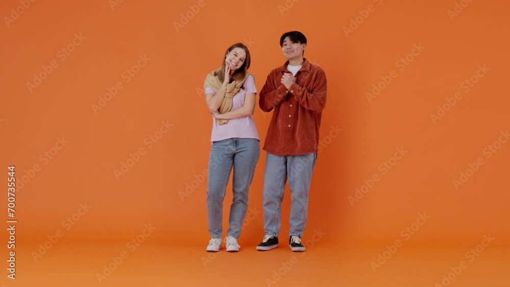 Young couple of European lady and Asian guy dreaming in room Young couple of European lady and Asian guy dreaming in room