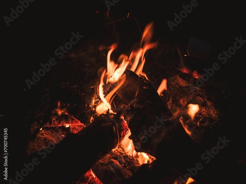Closeup view of a wood campfire burning at night