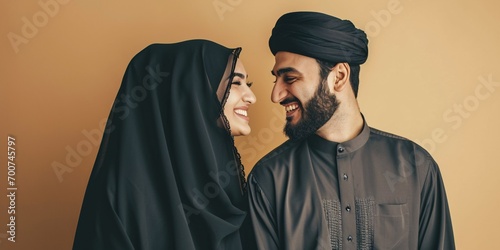 Lovely Arabian couple in traditional attire enjoying each other's company in a Dubai studio.