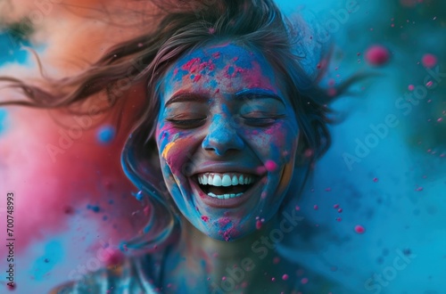 a smiling woman with colorful powder around her