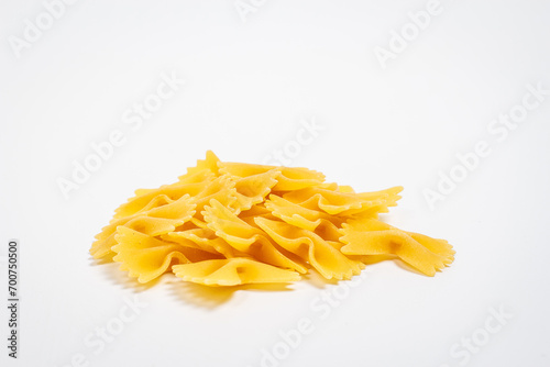 Raw pasta on white background